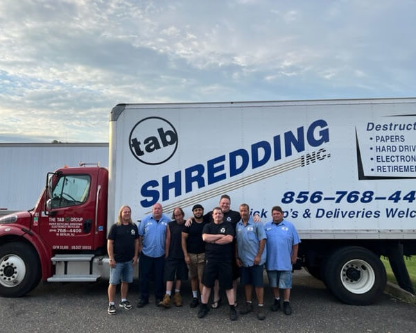 Tab Group Inc - Paper shredding team next to truck